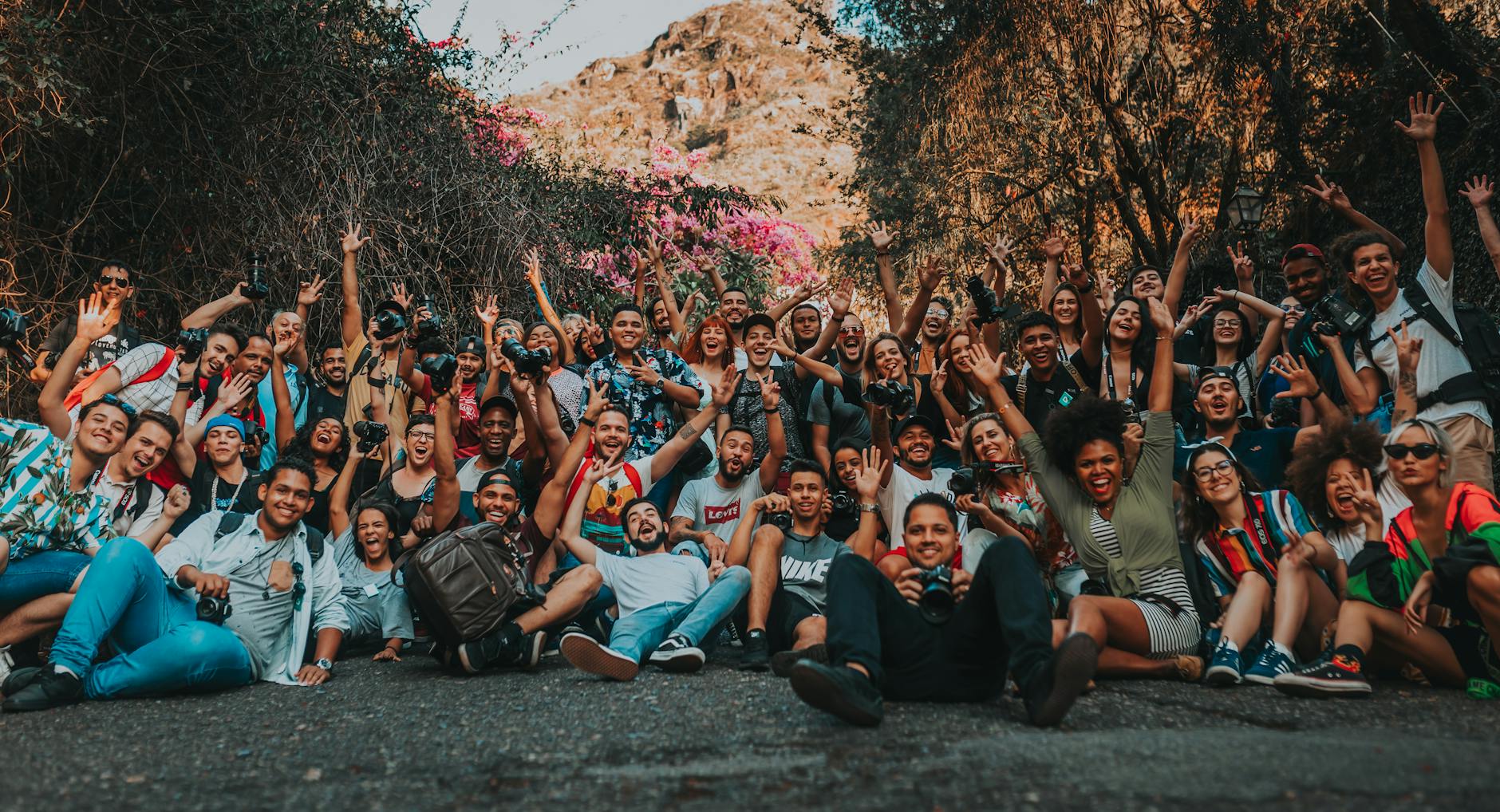 Group of travelers hiking through scenic mountains